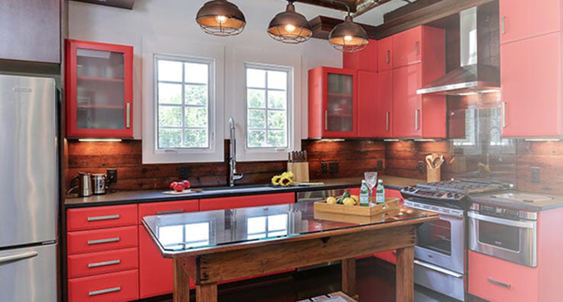 kitchen featuring red cabinetry and millwork